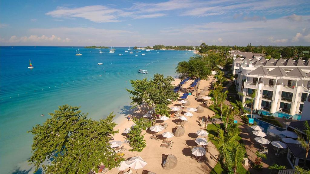 an aerial view of a beach with umbrellas and buildings at Azul Beach Resort Negril, Gourmet All Inclusive by Karisma in Negril