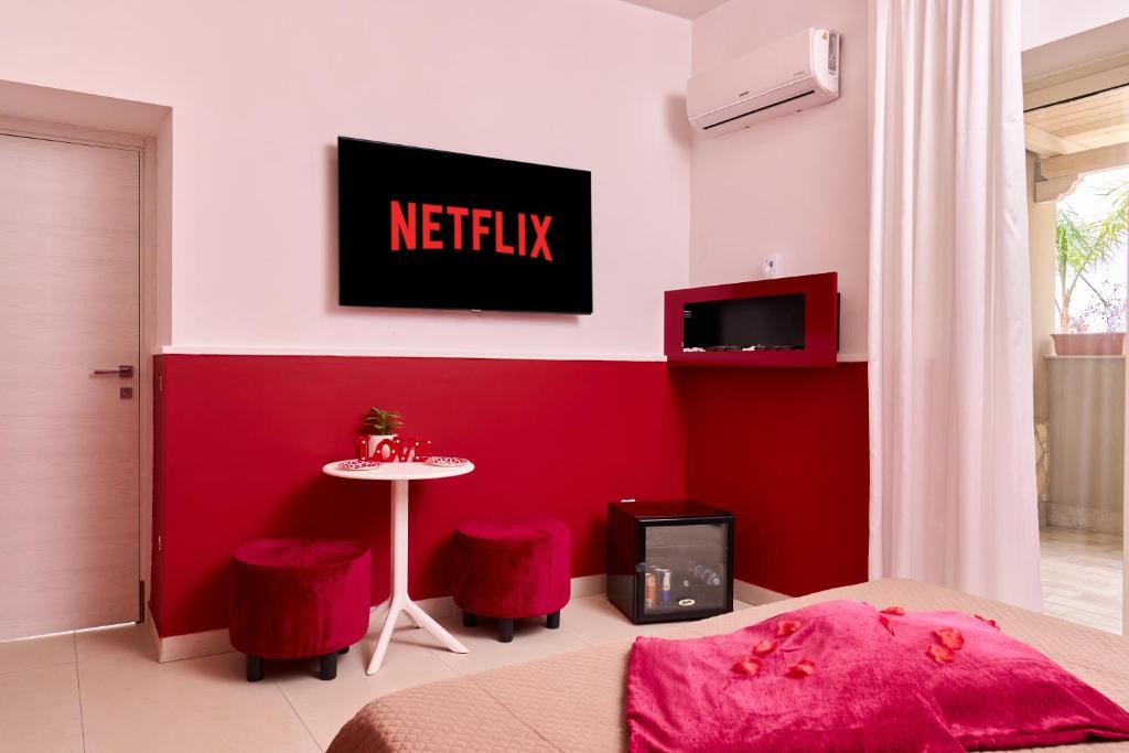TV a/nebo společenská místnost v ubytování Hotel Melydà