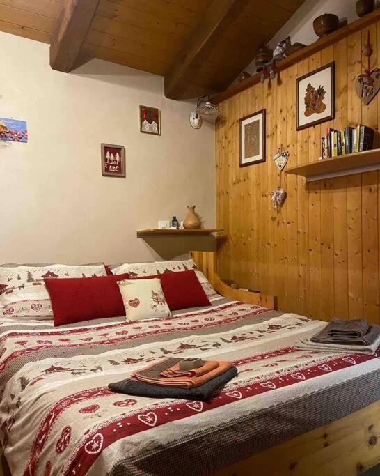 Postel nebo postele na pokoji v ubytování Il nocciòlo di Daisy