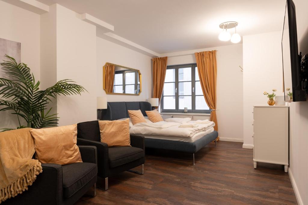 Postel nebo postele na pokoji v ubytování Zentral gelegenes Premium-Apartment mit viel Tageslicht