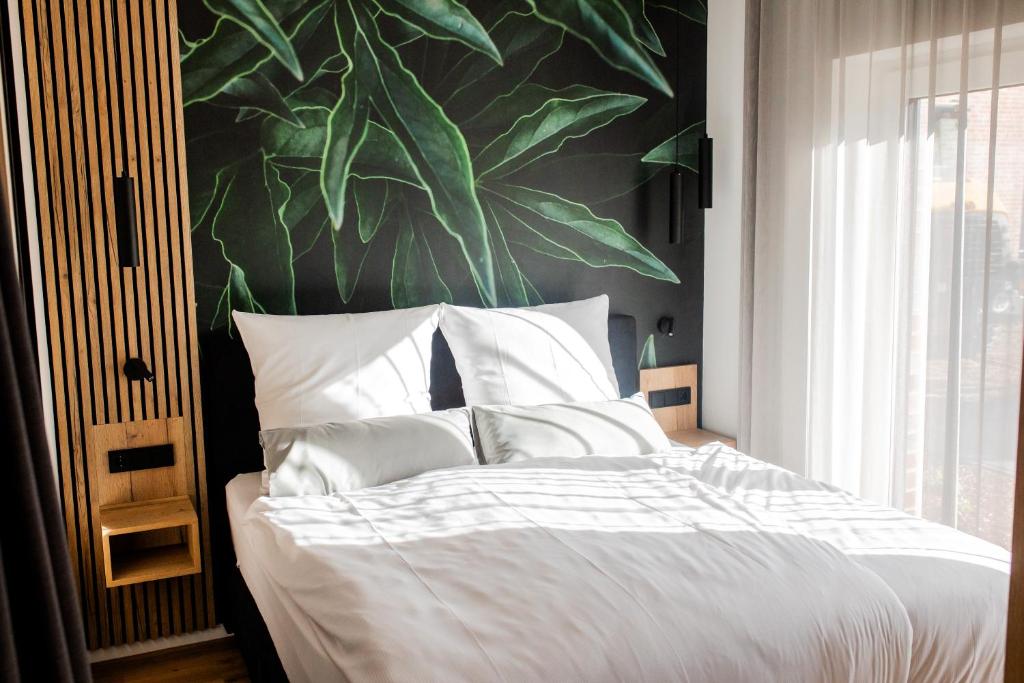 Postel nebo postele na pokoji v ubytování Boardinghouse Hense