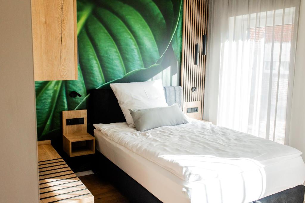 Postel nebo postele na pokoji v ubytování Boardinghouse Hense