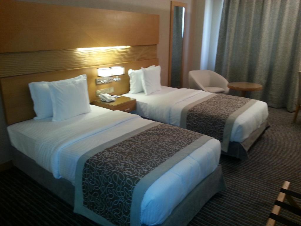 Postel nebo postele na pokoji v ubytování Hotel Hilen De Ville