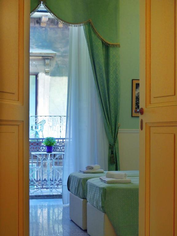 Postel nebo postele na pokoji v ubytování Bellini Inn Deluxe