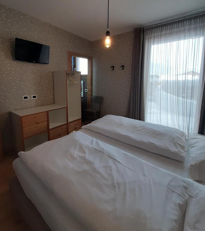 Postel nebo postele na pokoji v ubytování Cronox Vinecc
