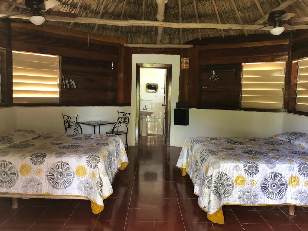 Postel nebo postele na pokoji v ubytování Costa De Cocos