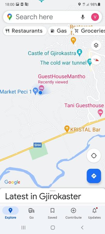 a screenshot of a cell phone with a map at GuestHouseMantho in Gjirokastër
