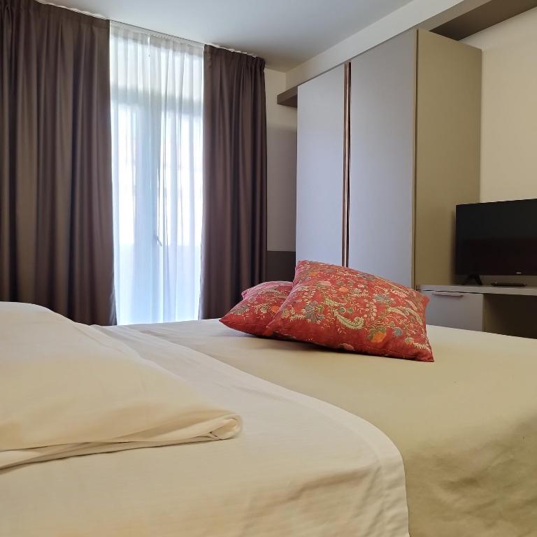 Łóżko lub łóżka w pokoju w obiekcie Casaalbergo La Rocca