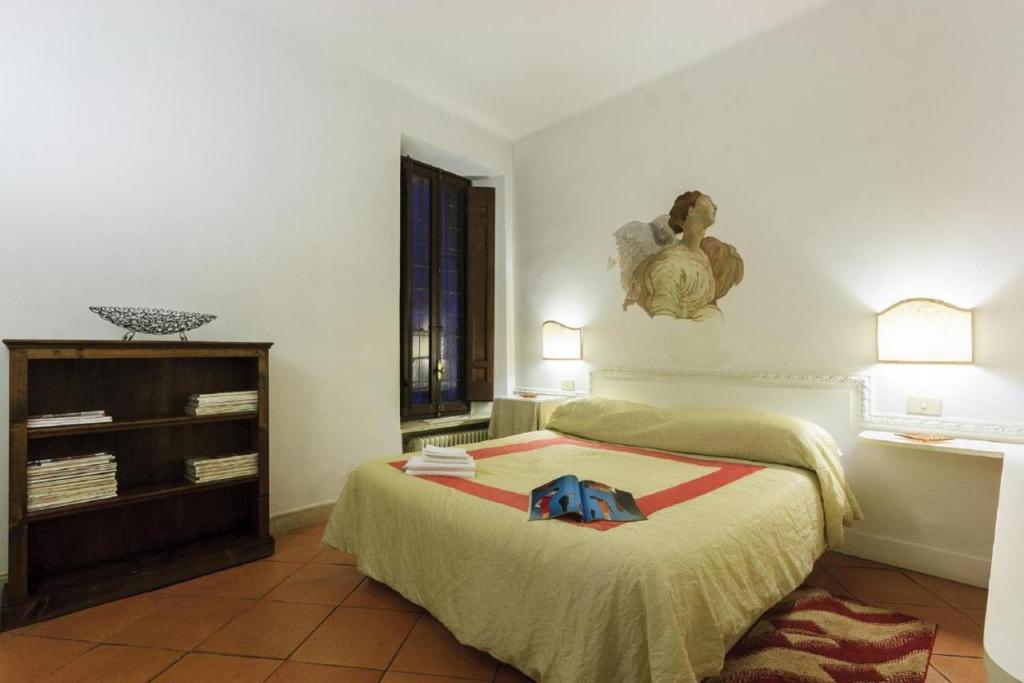 A bed or beds in a room at Palazzo Donarelli