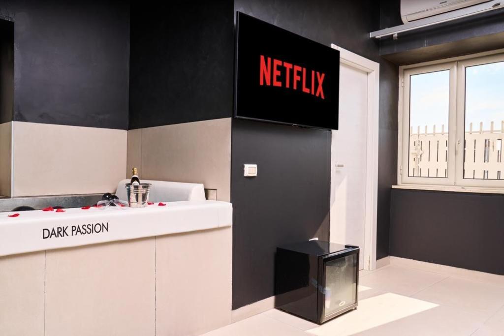 TV a/nebo společenská místnost v ubytování Hotel Melydà