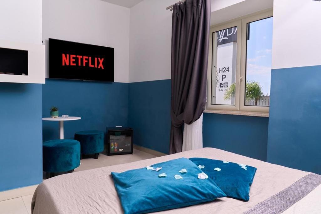 Postel nebo postele na pokoji v ubytování Hotel Melydà