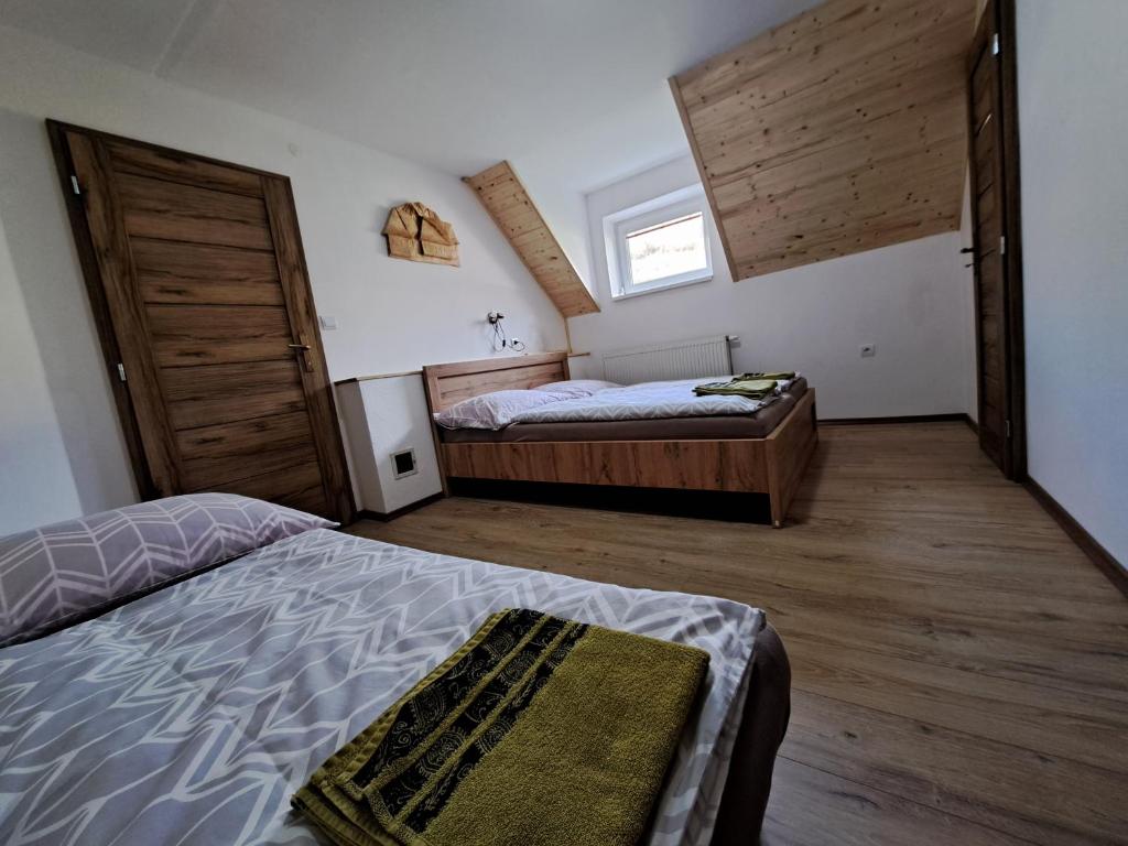A bed or beds in a room at Chata Berešík