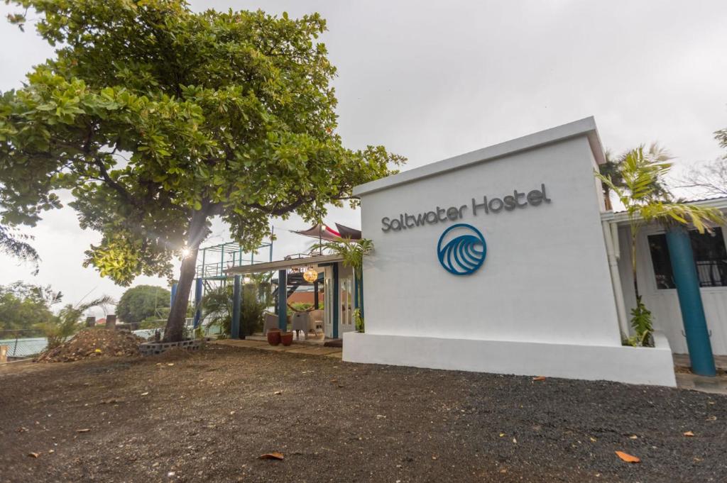 a building with the sign for a student hotel at Hostel SaltWater in San Juan del Sur