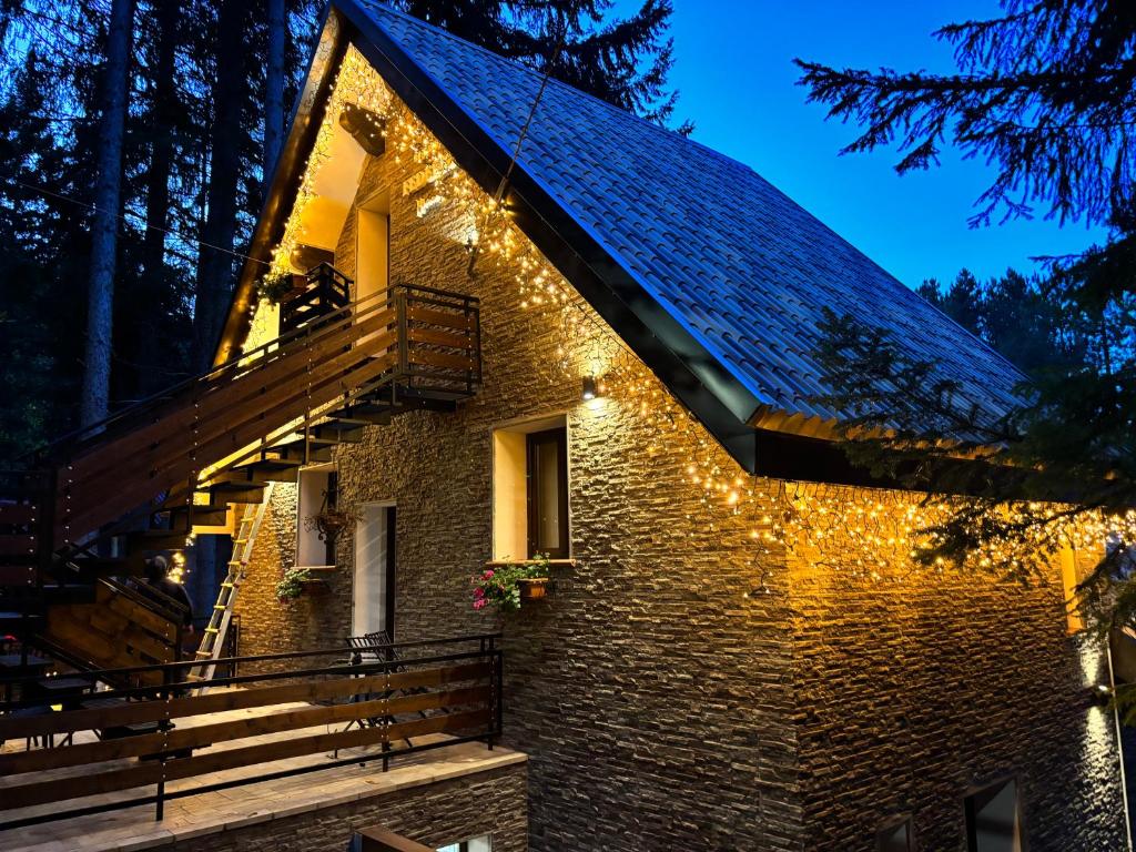 a brick house with lights on the roof at Rifugio Federici Home in Camigliatello Silano