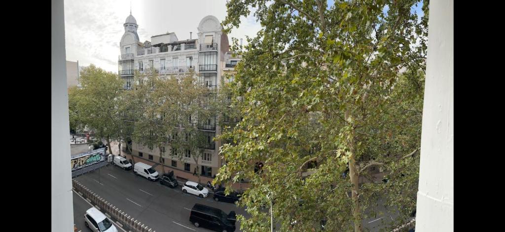 a view of a building with cars parked on a street at Salamanca Views in Madrid