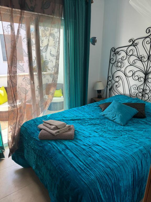 Postel nebo postele na pokoji v ubytování Villa Las Puertas