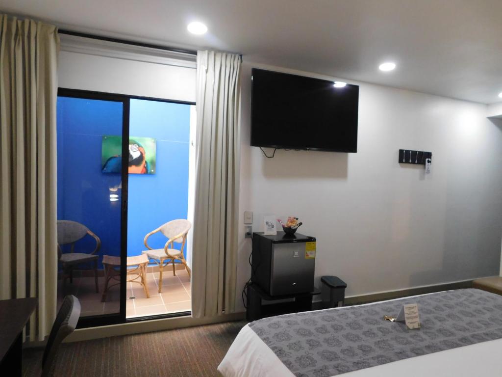TV a/nebo společenská místnost v ubytování Hotel Acqua Medellín
