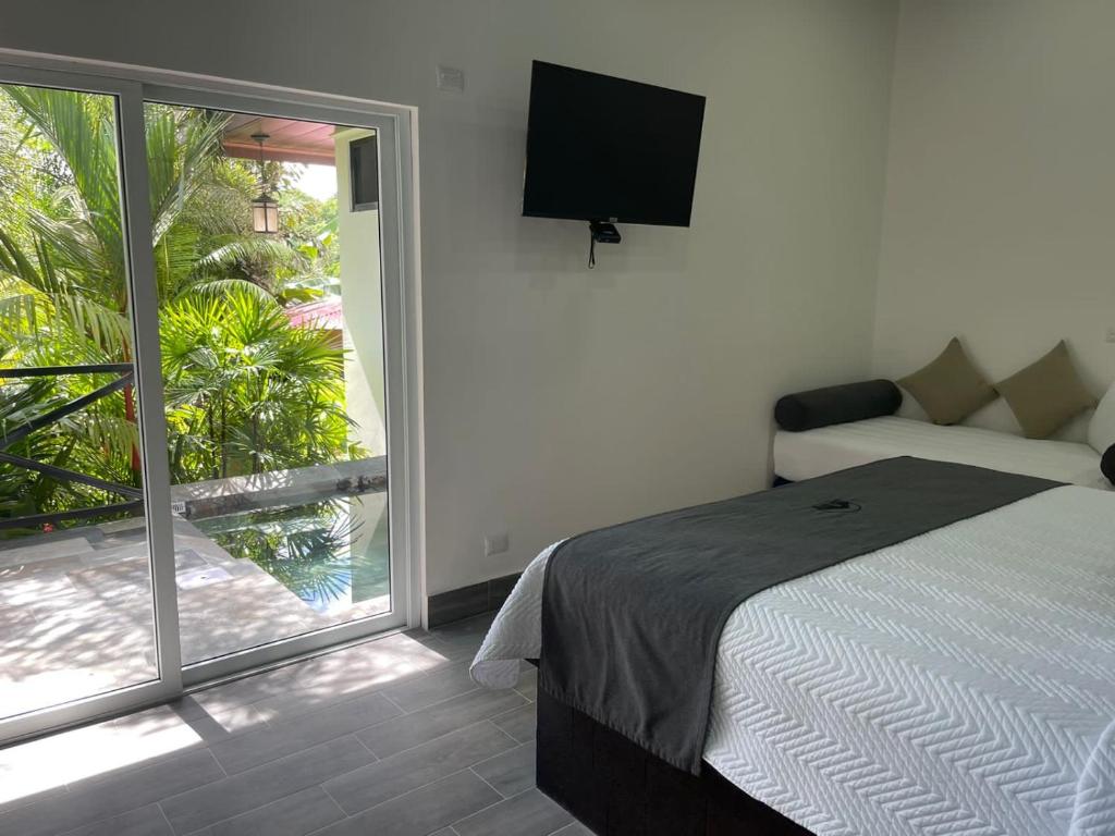 Postel nebo postele na pokoji v ubytování Hotel Boutique Casa Del Rio