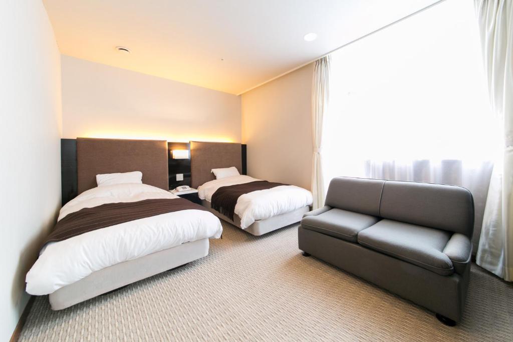 Postel nebo postele na pokoji v ubytování Hotel Crystal Palace