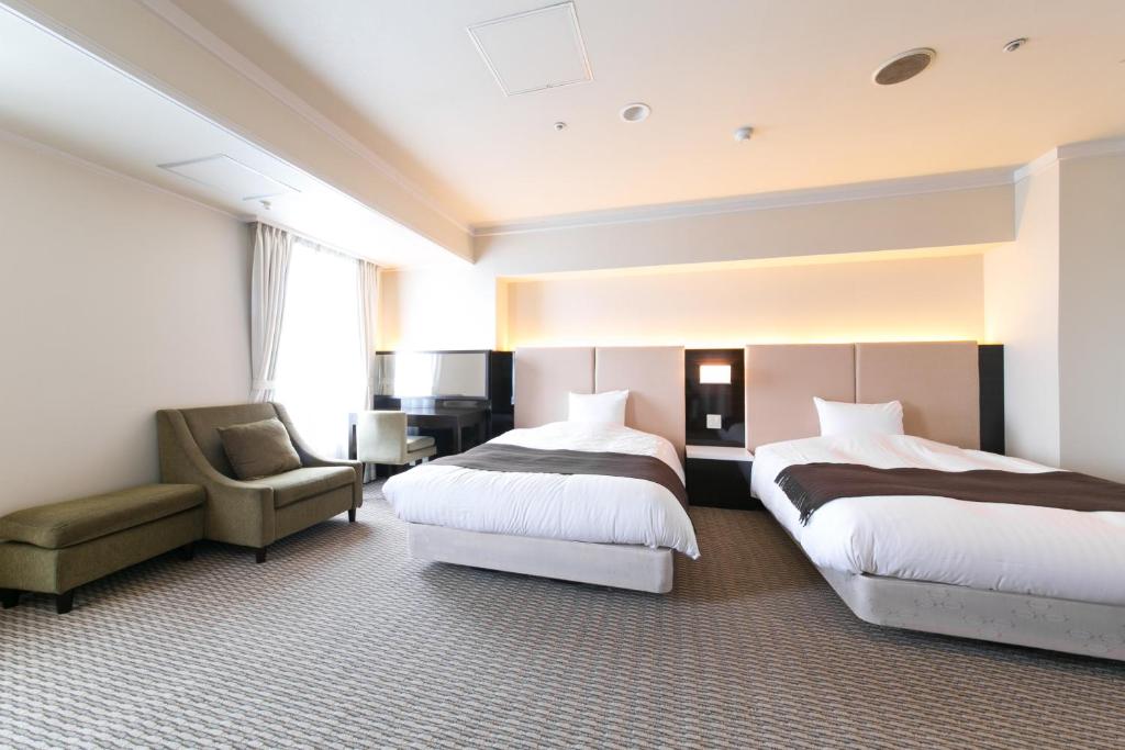 Postel nebo postele na pokoji v ubytování Hotel Crystal Palace