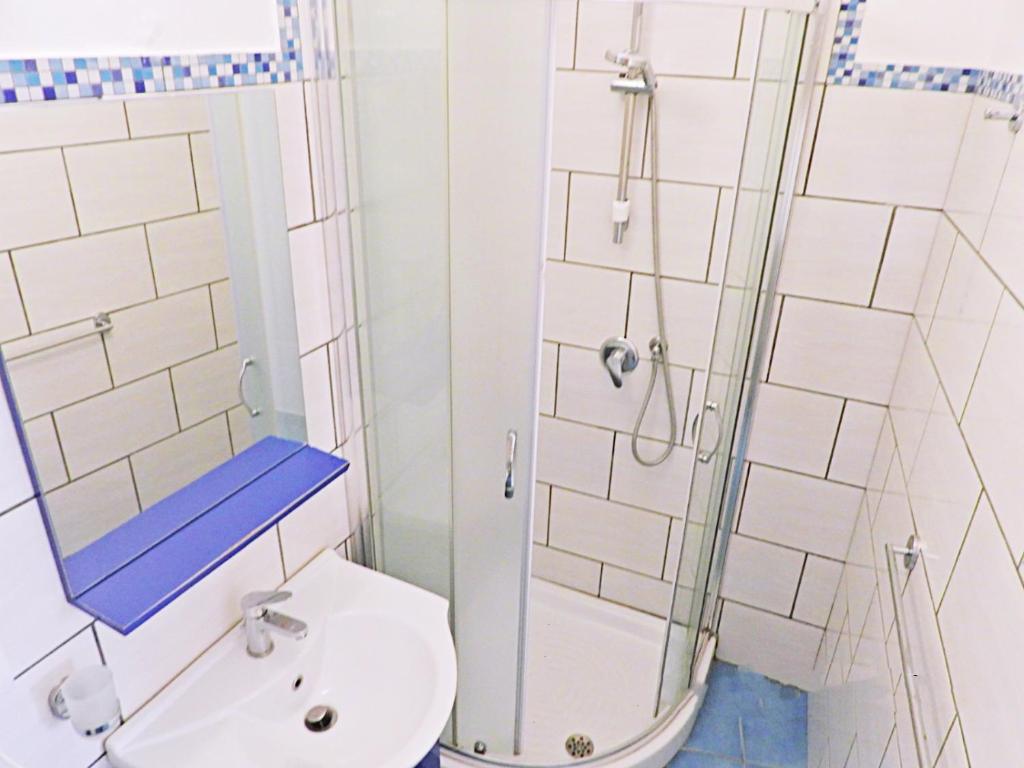 a bathroom with a shower and a toilet and a sink at B&B Il Paradiso di Capri in Anacapri