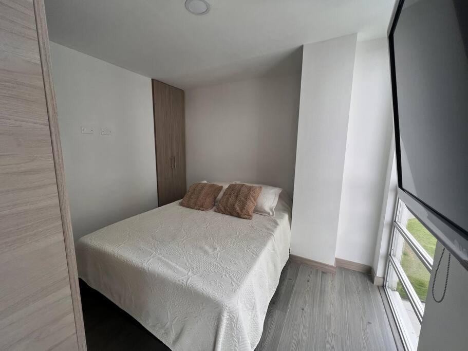 Postel nebo postele na pokoji v ubytování Cómodo apartaestudio