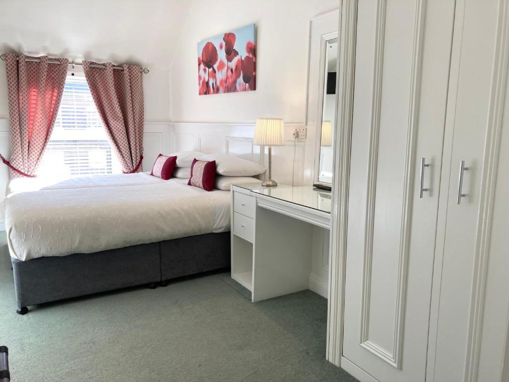 Krevet ili kreveti u jedinici u okviru objekta Dergvale Hotel
