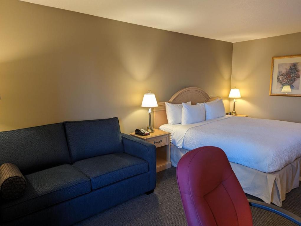 Postel nebo postele na pokoji v ubytování Nomad Hotel & Suites