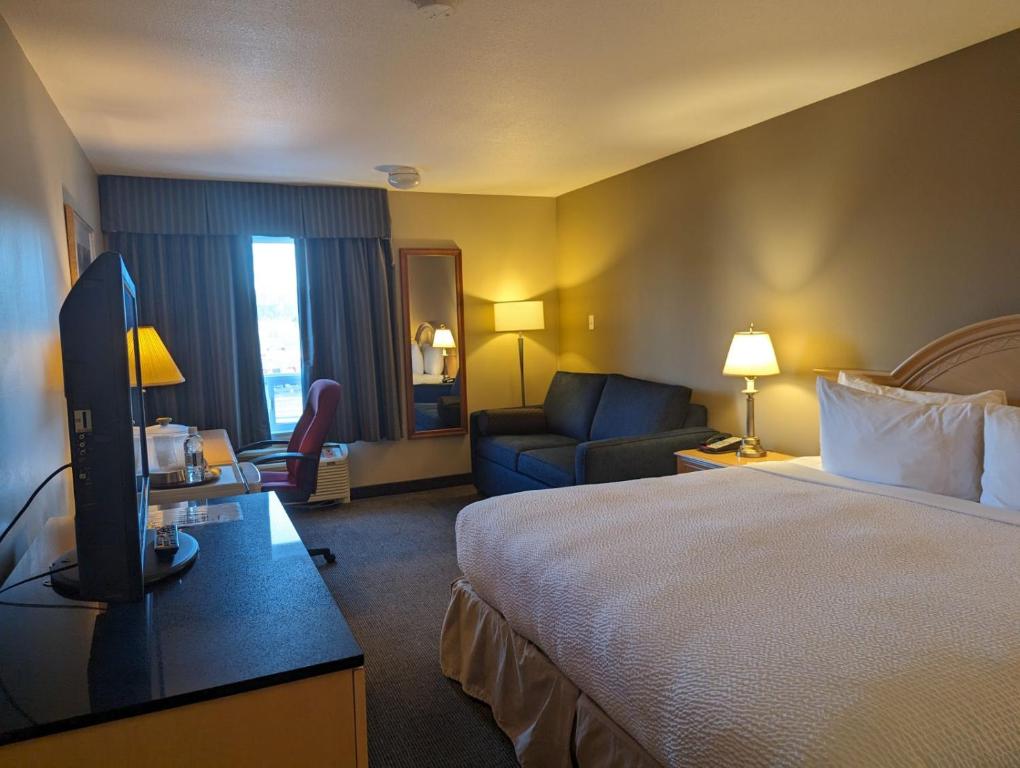 Postel nebo postele na pokoji v ubytování Nomad Hotel & Suites