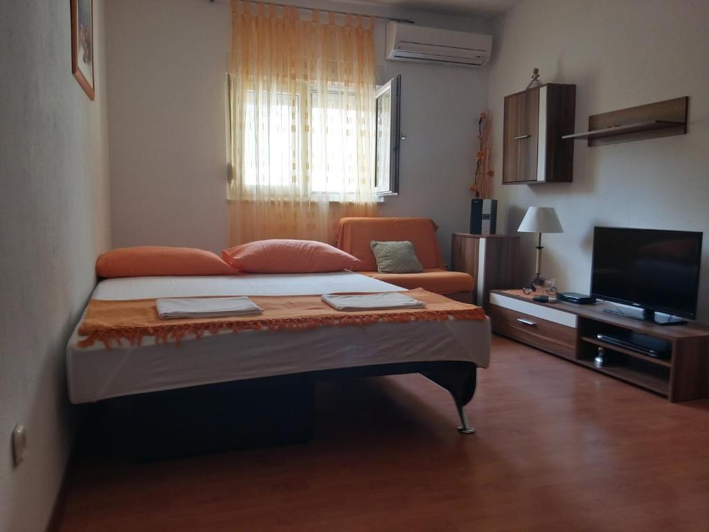 Postel nebo postele na pokoji v ubytování City Apartments Nada