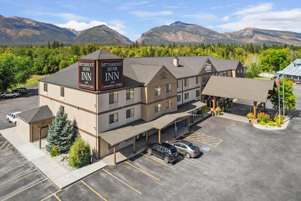 an aerial view of a hotel with a parking lot at Bitterroot River Inn and Conference Center in Hamilton