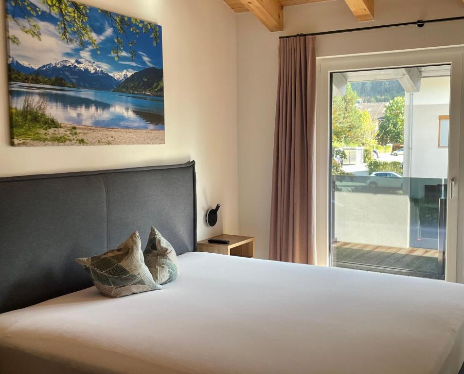Postel nebo postele na pokoji v ubytování Apartments Lakeside 29 Zell am See