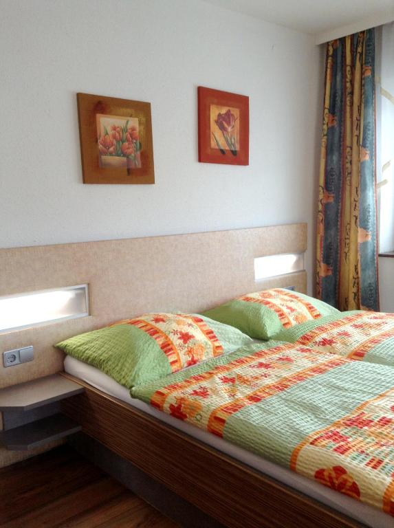 Postel nebo postele na pokoji v ubytování Pension La Mamma