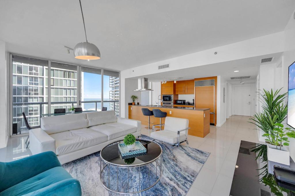 a living room with a couch and a table at *W ICON BRICKELL- LUXURY 2BR HIGHRISE CORNER CONDO** in Miami