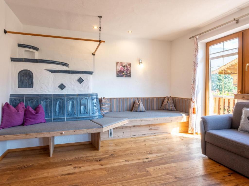 a living room with a couch and a table at Obinghof in Söll