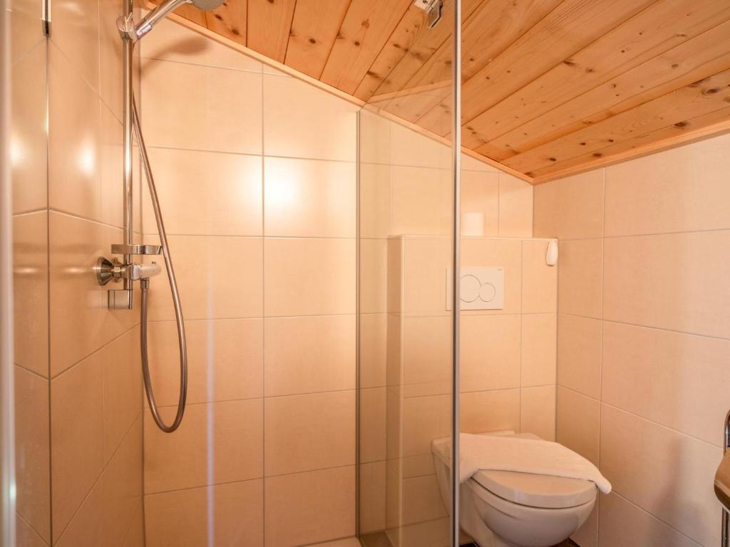 a bathroom with a shower and a toilet at Obinghof in Söll