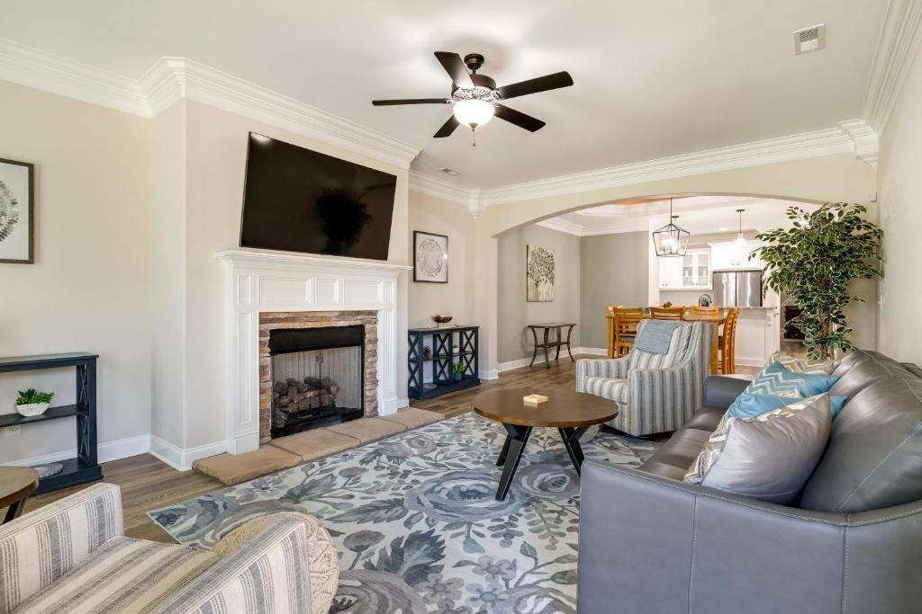 a living room with a couch and a fireplace at Charming Alabama Retreat with Patio and Pool Access! in Owens Cross Roads