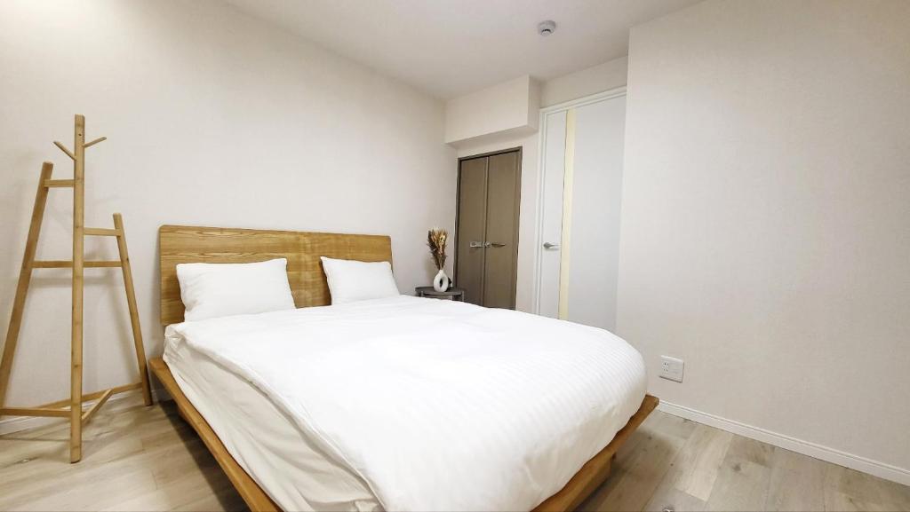 Postel nebo postele na pokoji v ubytování Hotel STAY ARI Higashishinjuku
