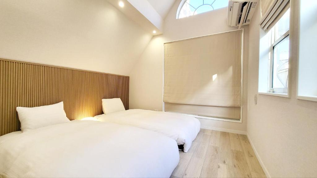 Postel nebo postele na pokoji v ubytování Hotel STAY ARI Higashishinjuku