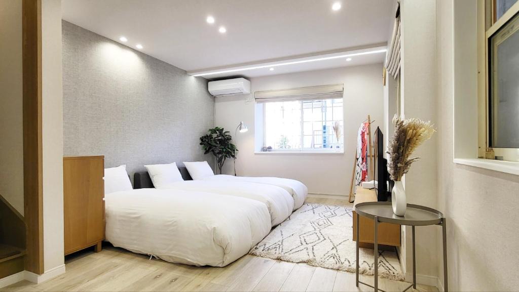Postel nebo postele na pokoji v ubytování Hotel STAY ARI Higashishinjuku