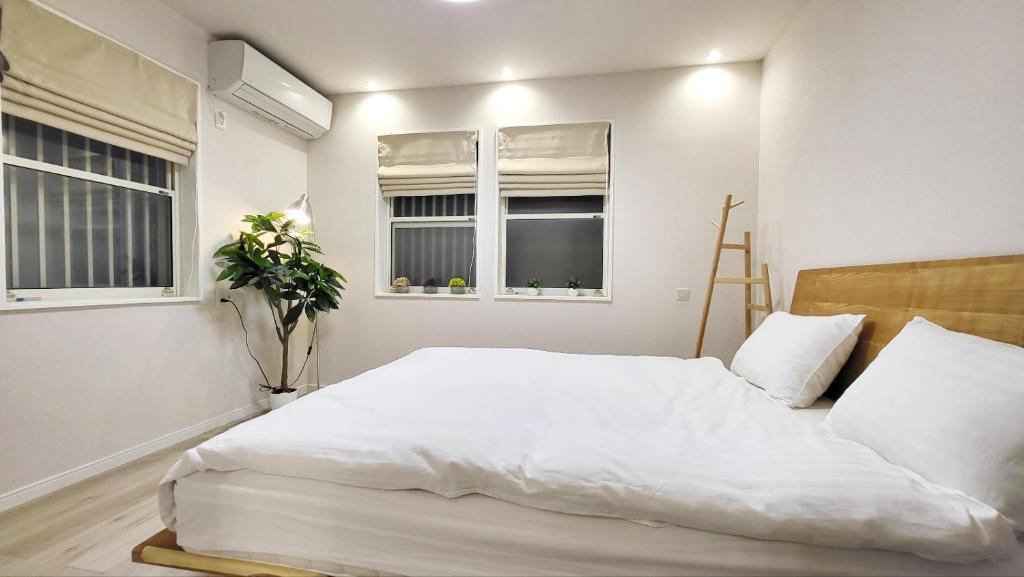 Postel nebo postele na pokoji v ubytování Hotel STAY ARI Higashishinjuku