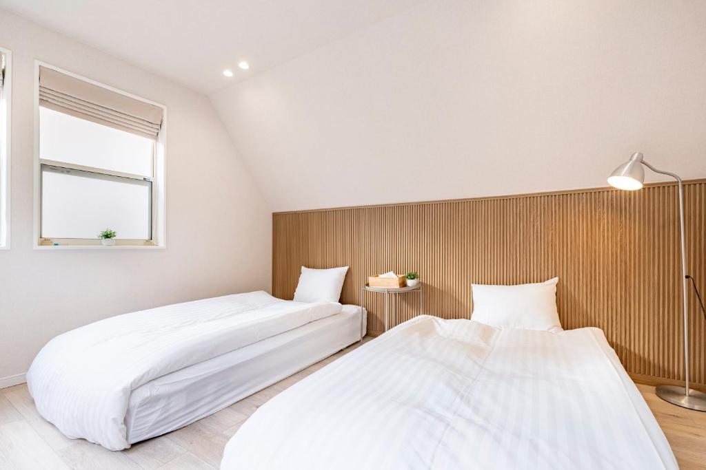 Postel nebo postele na pokoji v ubytování Hotel STAY ARI Higashishinjuku