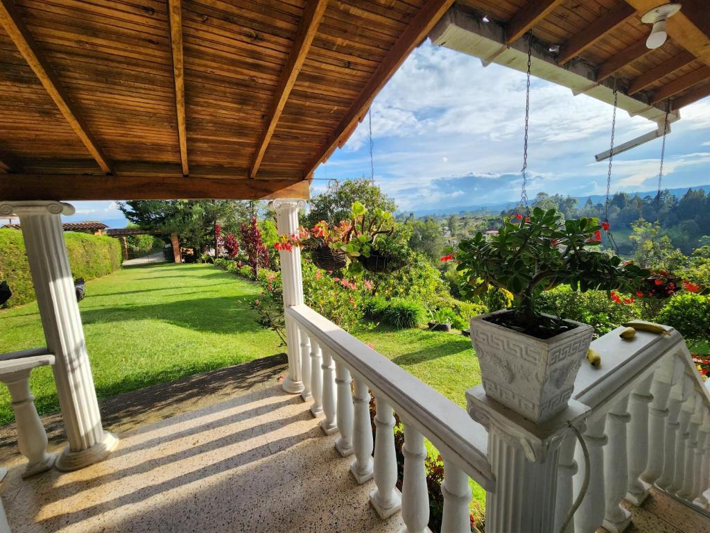 a porch with a plant in a vase on it at Casa de campo Jade, Rionegro in Rionegro
