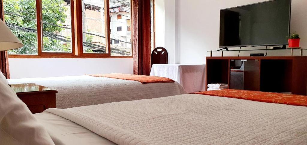 Postel nebo postele na pokoji v ubytování Hotel Romero Machupicchu