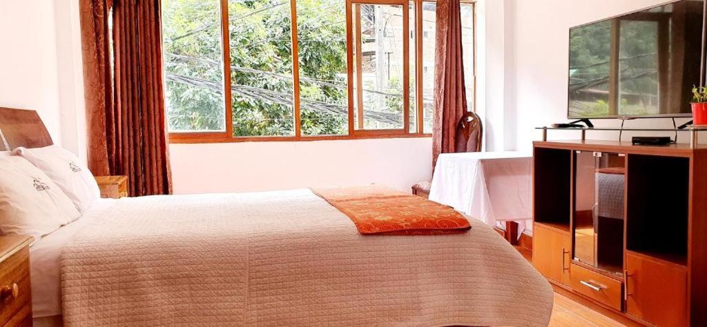 Postel nebo postele na pokoji v ubytování Hotel Romero Machupicchu
