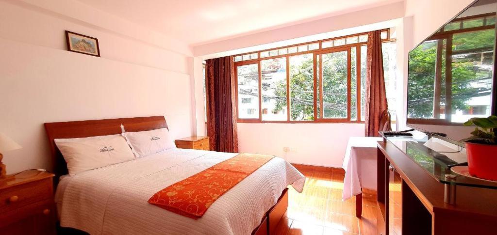 Postel nebo postele na pokoji v ubytování Hotel Romero Machupicchu