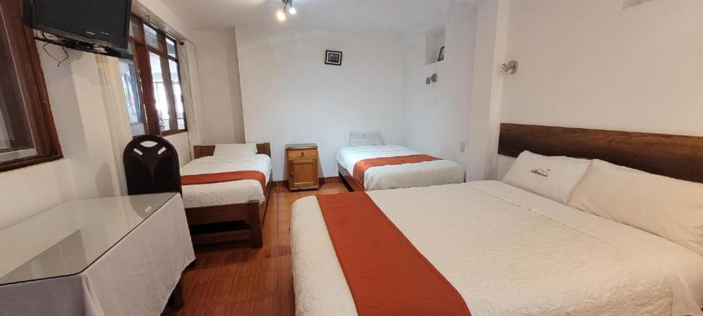 Postel nebo postele na pokoji v ubytování Hotel Romero Machupicchu