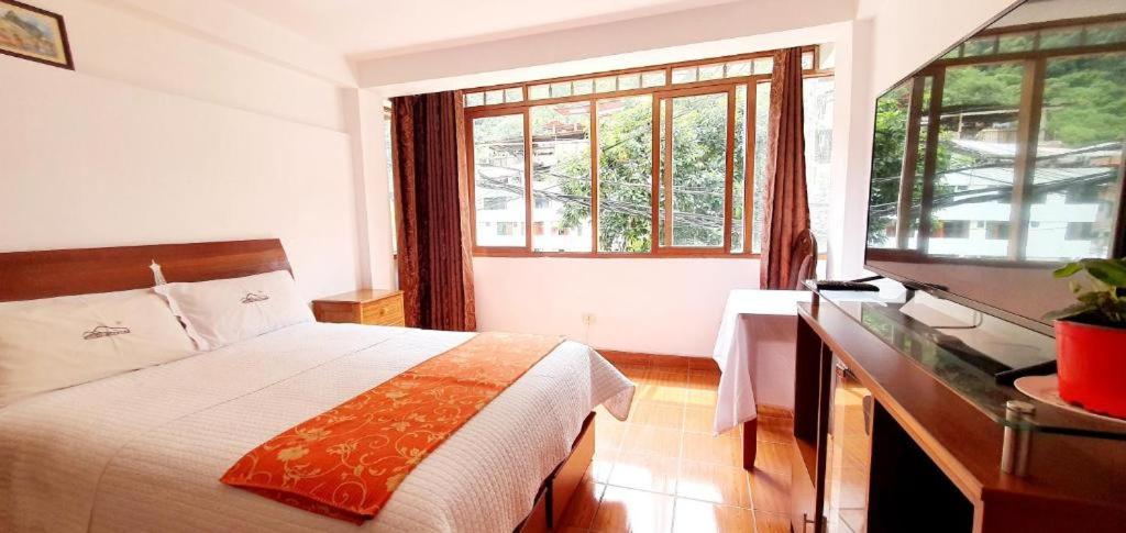 Postel nebo postele na pokoji v ubytování Hotel Romero Machupicchu