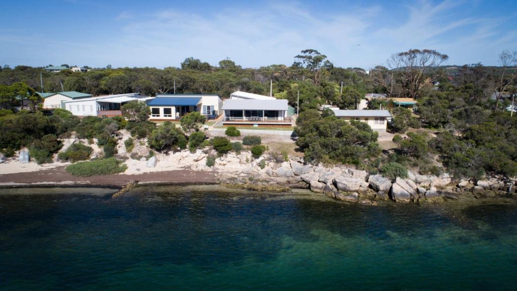 an aerial view of a house on an island in the water at Seasalt in Coffin Bay