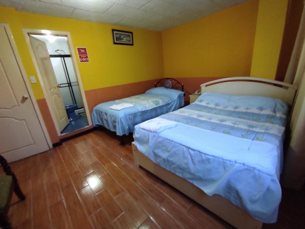 Postel nebo postele na pokoji v ubytování HOTEL CARIBEAN REAL